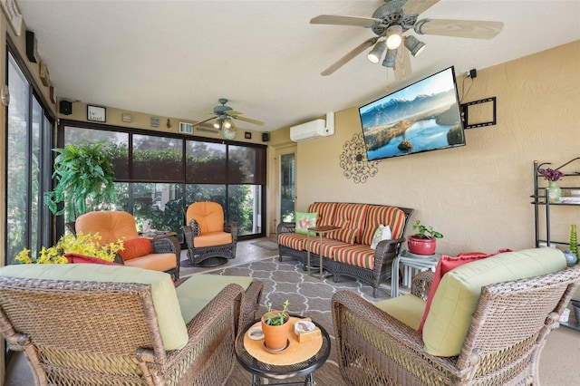 sunroom with plenty of natural light, a ceiling fan, and a wall mounted air conditioner