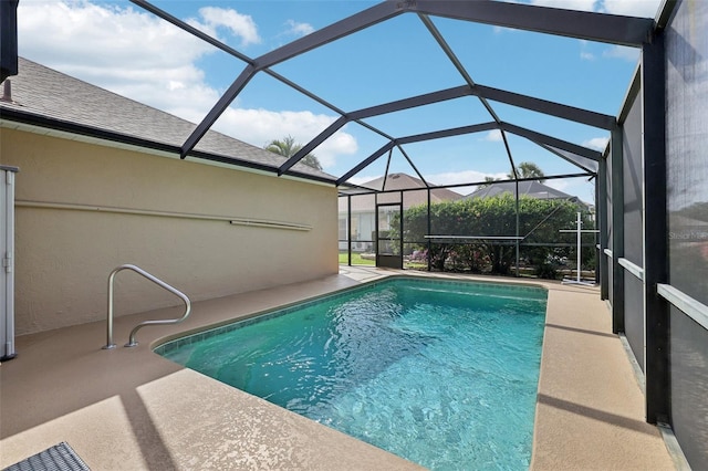 pool featuring a lanai and a patio area