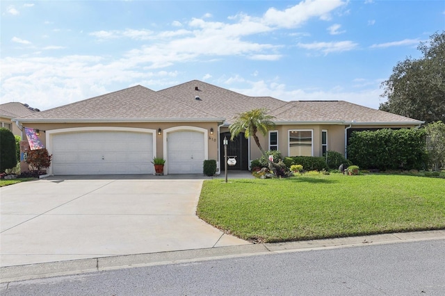 ranch-style home featuring roof with shingles, stucco siding, a front lawn, concrete driveway, and a garage