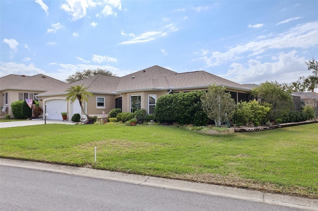 ranch-style house with concrete driveway, a garage, a front lawn, and stucco siding