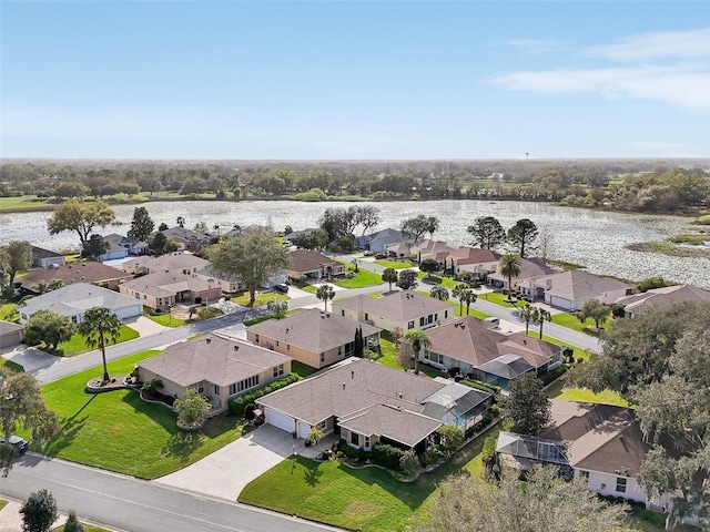 bird's eye view with a residential view and a water view