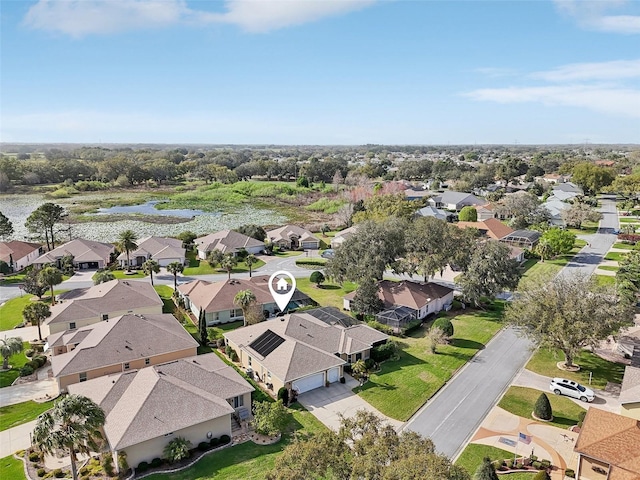 aerial view with a residential view and a water view