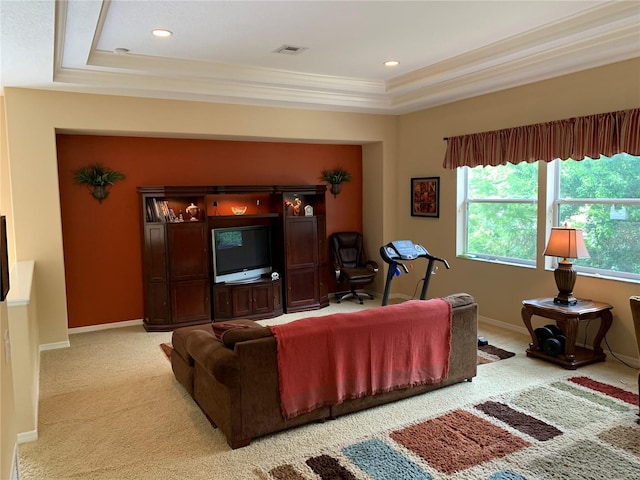 living area featuring a raised ceiling, visible vents, baseboards, and light carpet