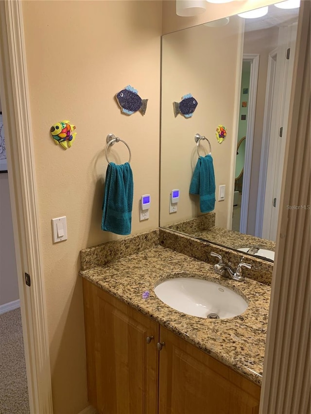 5271 Visionary Ct, Sarasota, FL 34233 - bathroom featuring vanity and baseboards