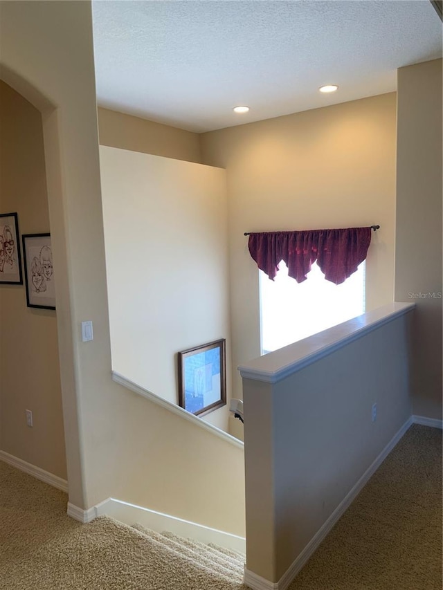 5271 Visionary Ct, Sarasota, FL 34233 - hallway with carpet, an upstairs landing, recessed lighting, and a textured ceiling