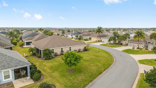 birds eye view of property with a residential view