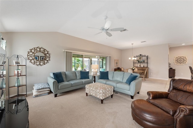 living room featuring lofted ceiling, light colored carpet, baseboards, and ceiling fan with notable chandelier