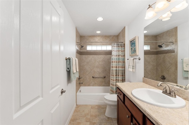 full bathroom featuring toilet, shower / bath combo with shower curtain, vanity, and baseboards