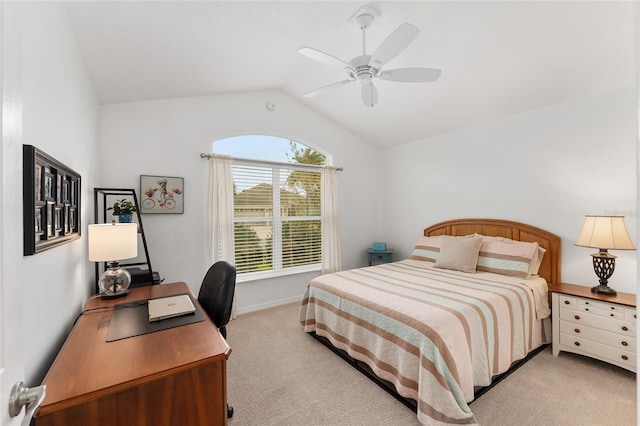 bedroom featuring vaulted ceiling, a ceiling fan, and light colored carpet