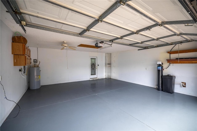 garage featuring electric water heater and a garage door opener