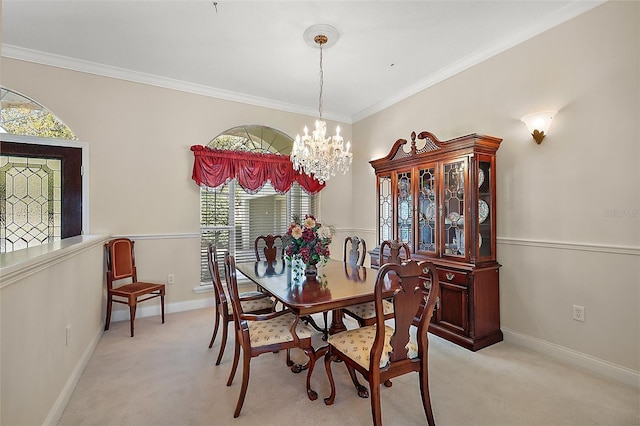 dining room featuring light carpet, an inviting chandelier, baseboards, and crown molding