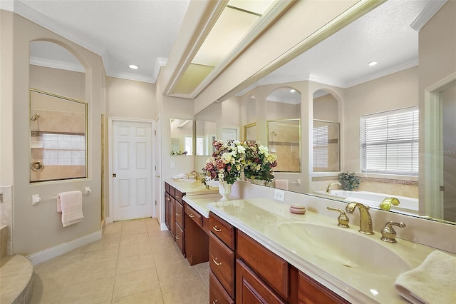 full bath featuring tile patterned floors, crown molding, vanity, a shower stall, and a bath