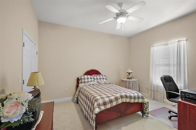 bedroom with carpet flooring, a ceiling fan, and baseboards