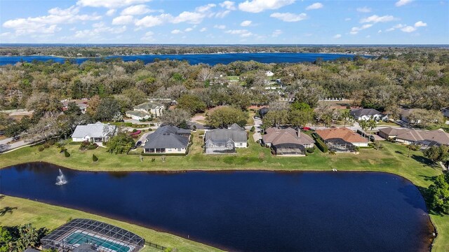 drone / aerial view with a residential view and a water view