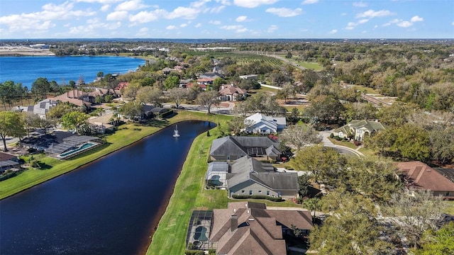 drone / aerial view featuring a water view and a residential view