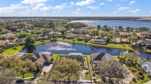 aerial view featuring a water view and a residential view