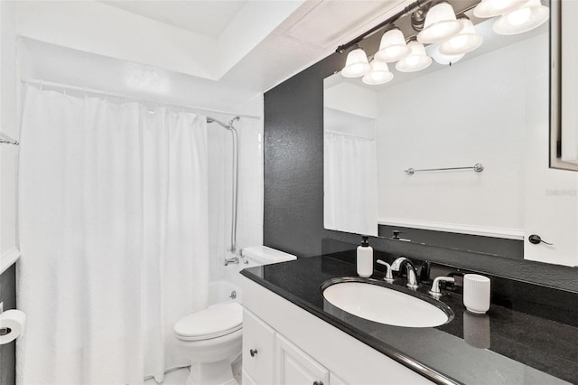 bathroom featuring toilet, shower / bath combination with curtain, and vanity