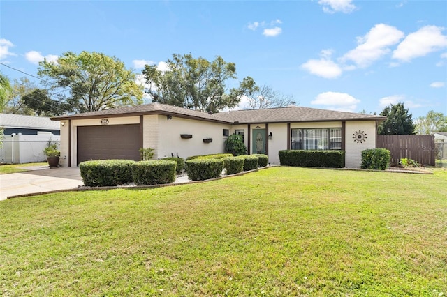 ranch-style home with concrete driveway, brick siding, fence, and an attached garage