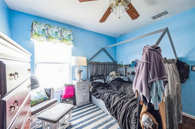 bedroom with ceiling fan and visible vents