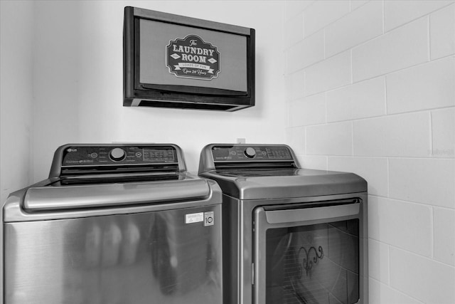 laundry room featuring laundry area and washing machine and clothes dryer