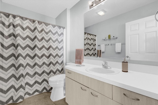 full bathroom featuring toilet, curtained shower, vanity, and tile patterned floors