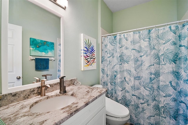 full bath featuring curtained shower, vanity, and toilet