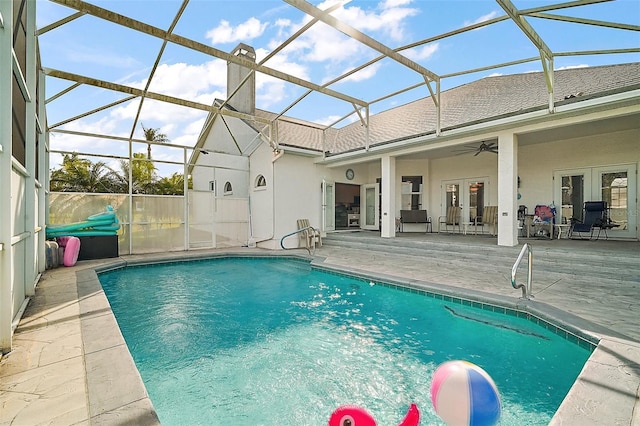 view of swimming pool with a lanai, a fenced in pool, french doors, and a patio