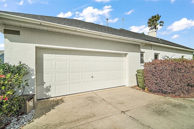 garage featuring driveway