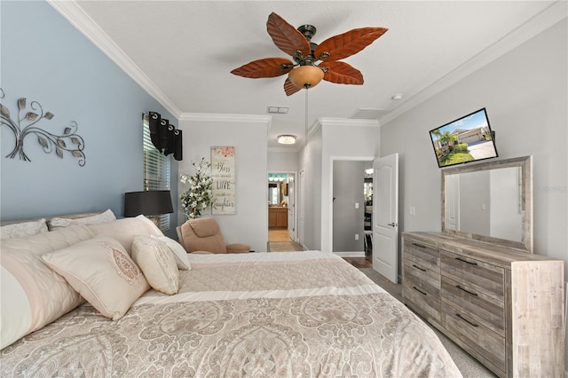 bedroom featuring a ceiling fan, ensuite bathroom, baseboards, and ornamental molding