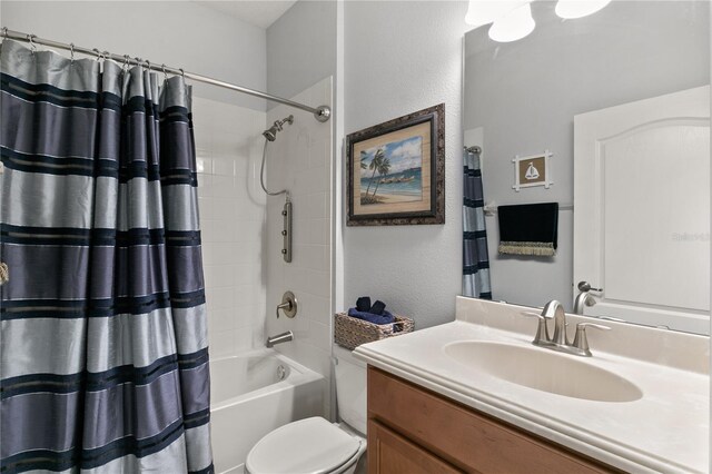 bathroom featuring vanity, shower / tub combo, and toilet