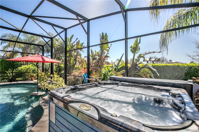 view of patio / terrace featuring glass enclosure, an outdoor pool, and a hot tub