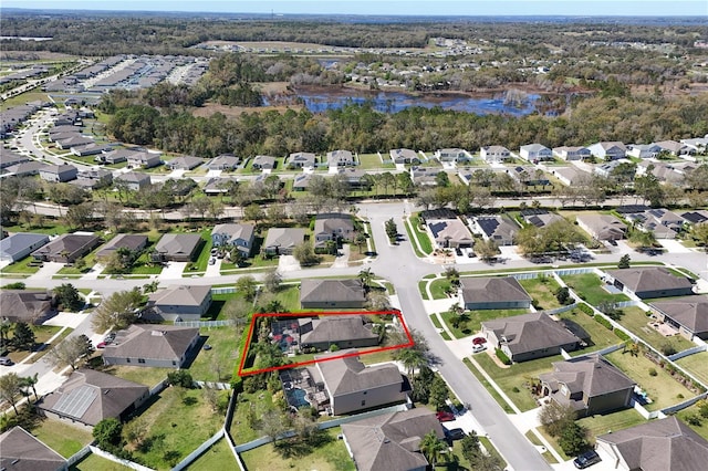 aerial view featuring a water view and a residential view