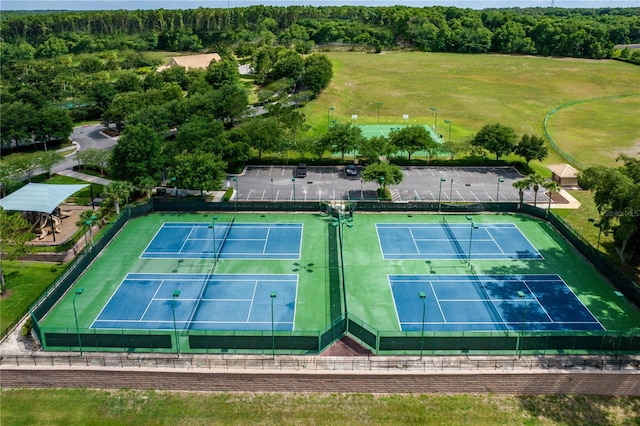 birds eye view of property with a forest view