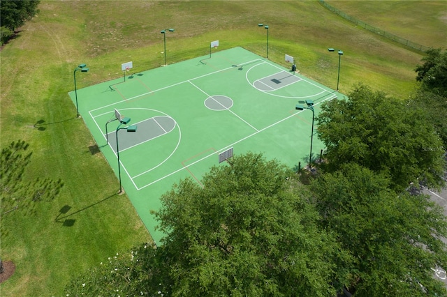 view of sport court featuring a lawn and community basketball court