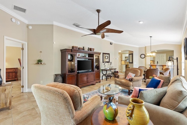 living room featuring visible vents, arched walkways, and ornamental molding