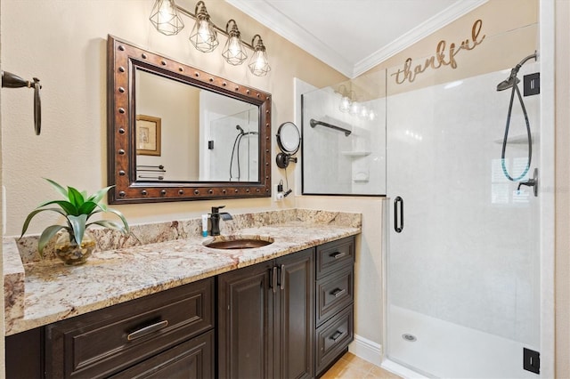 bathroom featuring a shower stall, ornamental molding, and vanity