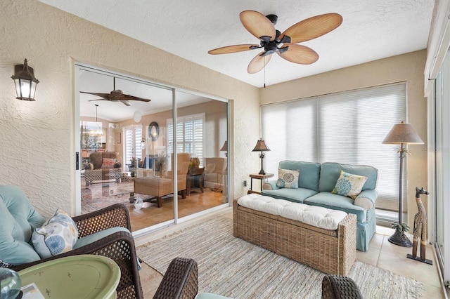 sunroom with a ceiling fan