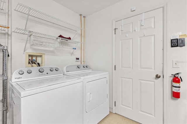 laundry room featuring laundry area and washing machine and clothes dryer