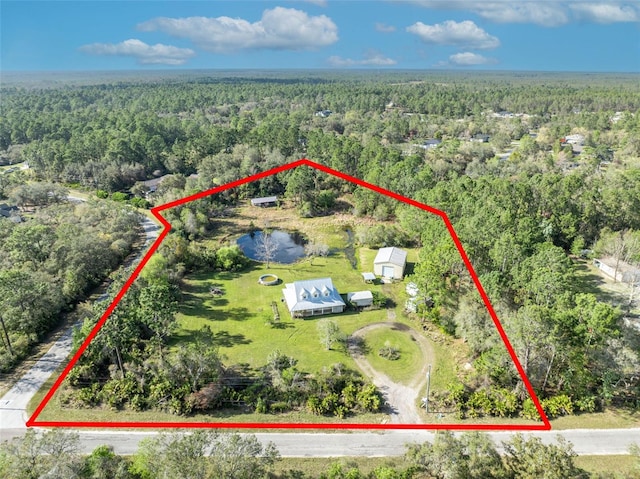 drone / aerial view with a forest view