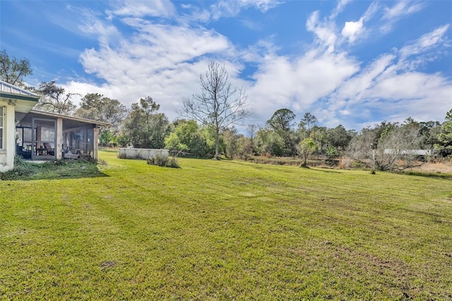 view of yard with a sunroom