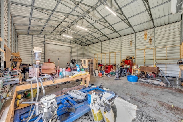 garage featuring a workshop area and metal wall