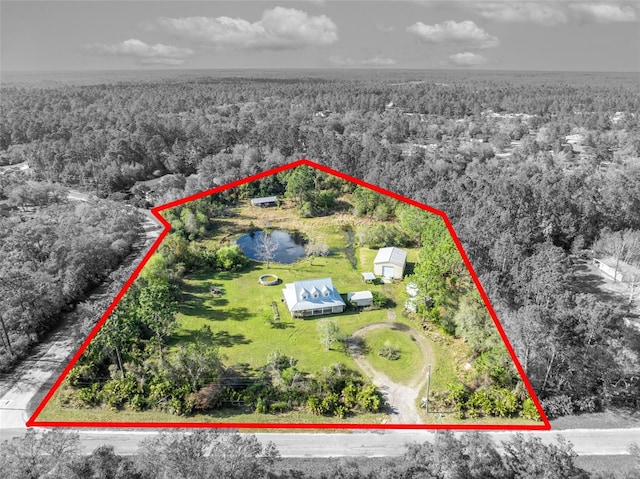 aerial view featuring a view of trees