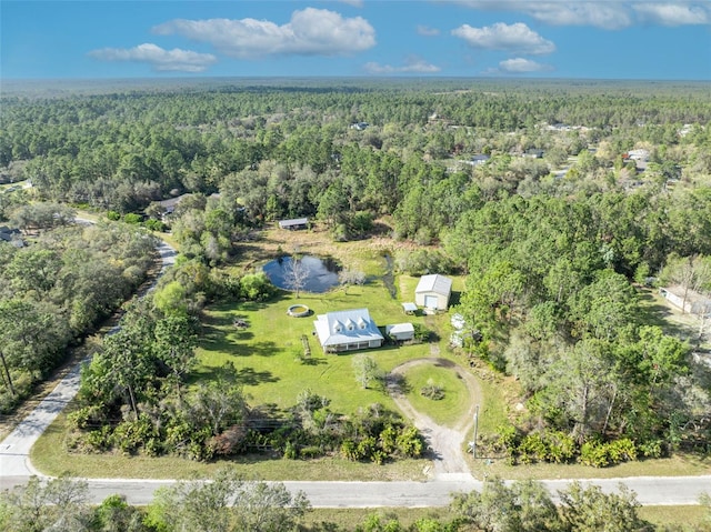 aerial view featuring a view of trees