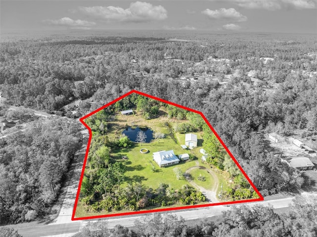 aerial view featuring a view of trees