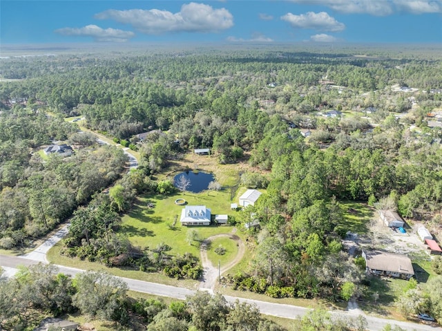 bird's eye view featuring a wooded view