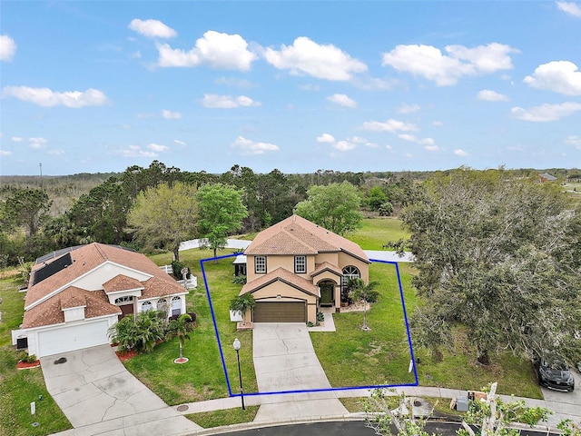 aerial view featuring a wooded view