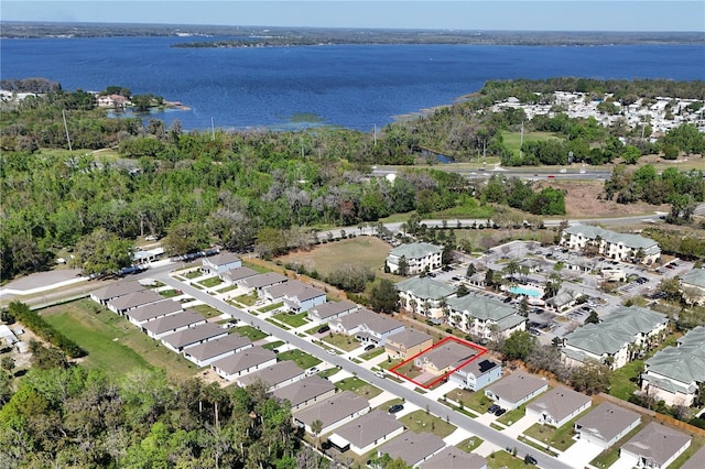 birds eye view of property with a residential view and a water view