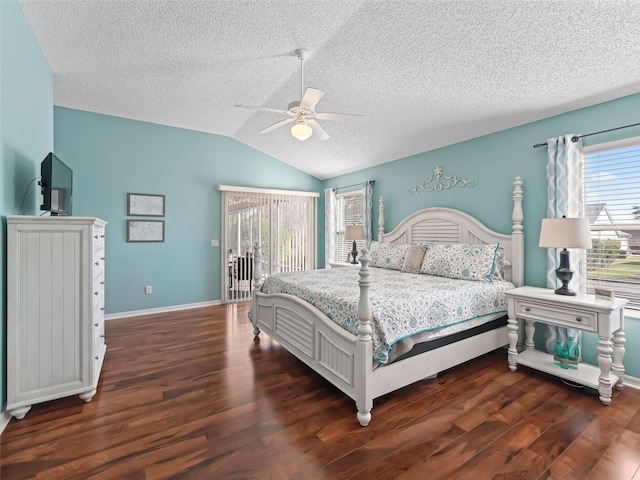 bedroom featuring lofted ceiling, a textured ceiling, wood finished floors, a ceiling fan, and baseboards