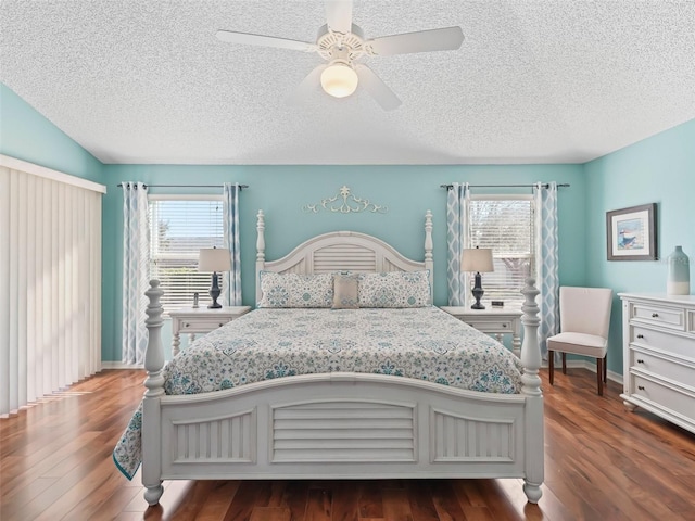 bedroom with ceiling fan, a textured ceiling, and wood finished floors