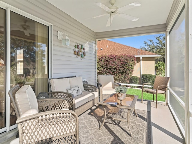 sunroom / solarium featuring ceiling fan